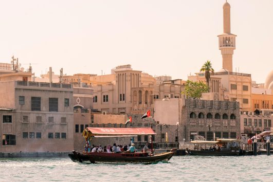 Traditional abra boat ferrying passengers across Dubai Creek