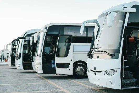 luxury bus fleet parked for group transport services in Dubai