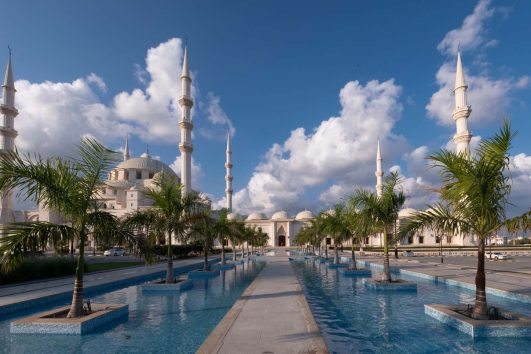 Side view of Sheikh Zayed Mosque Fujairah with blue sky background