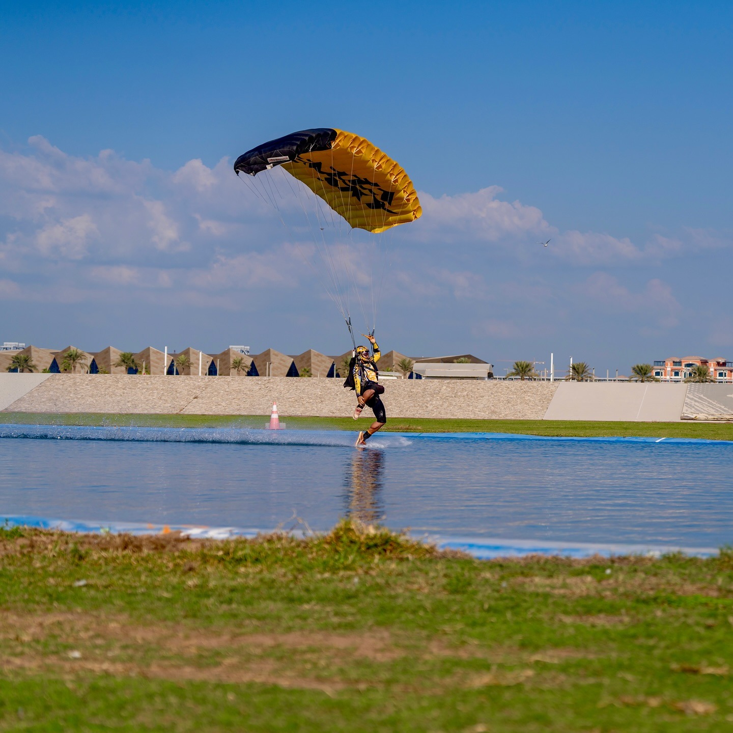 Skydiver landing with parachute at Dubai skydive drop zone