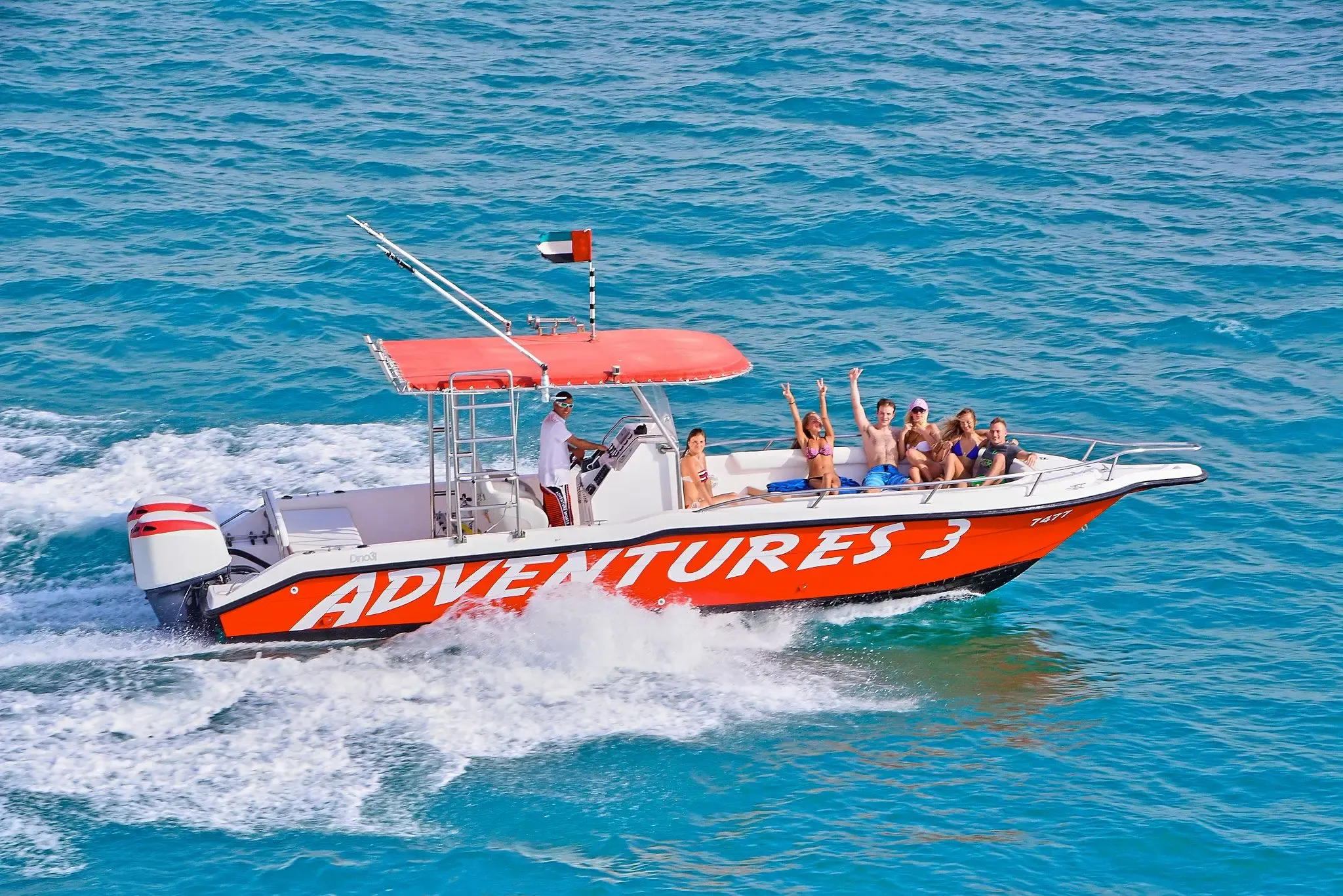 Speed boat flying the UAE flag during an Abu Dhabi water adventure