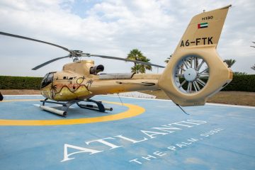 Falcon helicopter on helipad at The Palm Dubai ready for takeoff