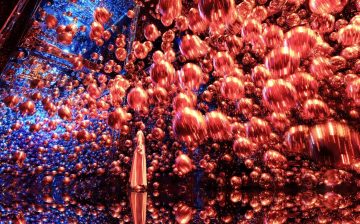 floating red lanterns in mirror room immersive digital art installation