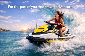 Woman riding a jet ski near Dubai skyline with waves splashing