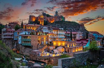 Tbilisi old town at sunset with Narikala Fortress and colorful houses