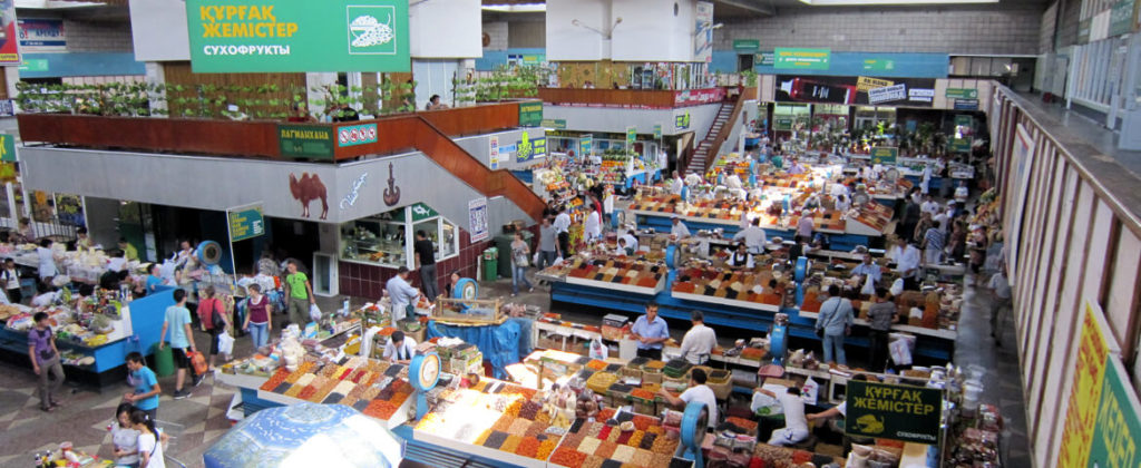 Interior of Old Green Bazaar with spice and food stalls in Almaty