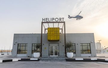 Helipad building exterior with helicopter landing in Abu Dhabi