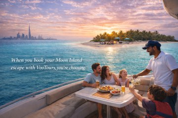 Family enjoying food and drinks on luxury yacht near Moon Island at sunset