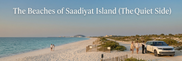 Saadiyat Island quiet beach Abu Dhabi with luxury chauffeur SUV and couple walking by the shore