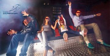 family enjoying 4D motion ride cinema experience at Dubai Dolphinarium