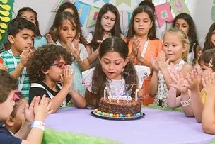 children celebrating birthday party inside indoor rainforest Dubai