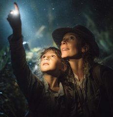 mother and child exploring rainforest at night with soft lighting Dubai