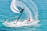 Man performing a flyboarding maneuver