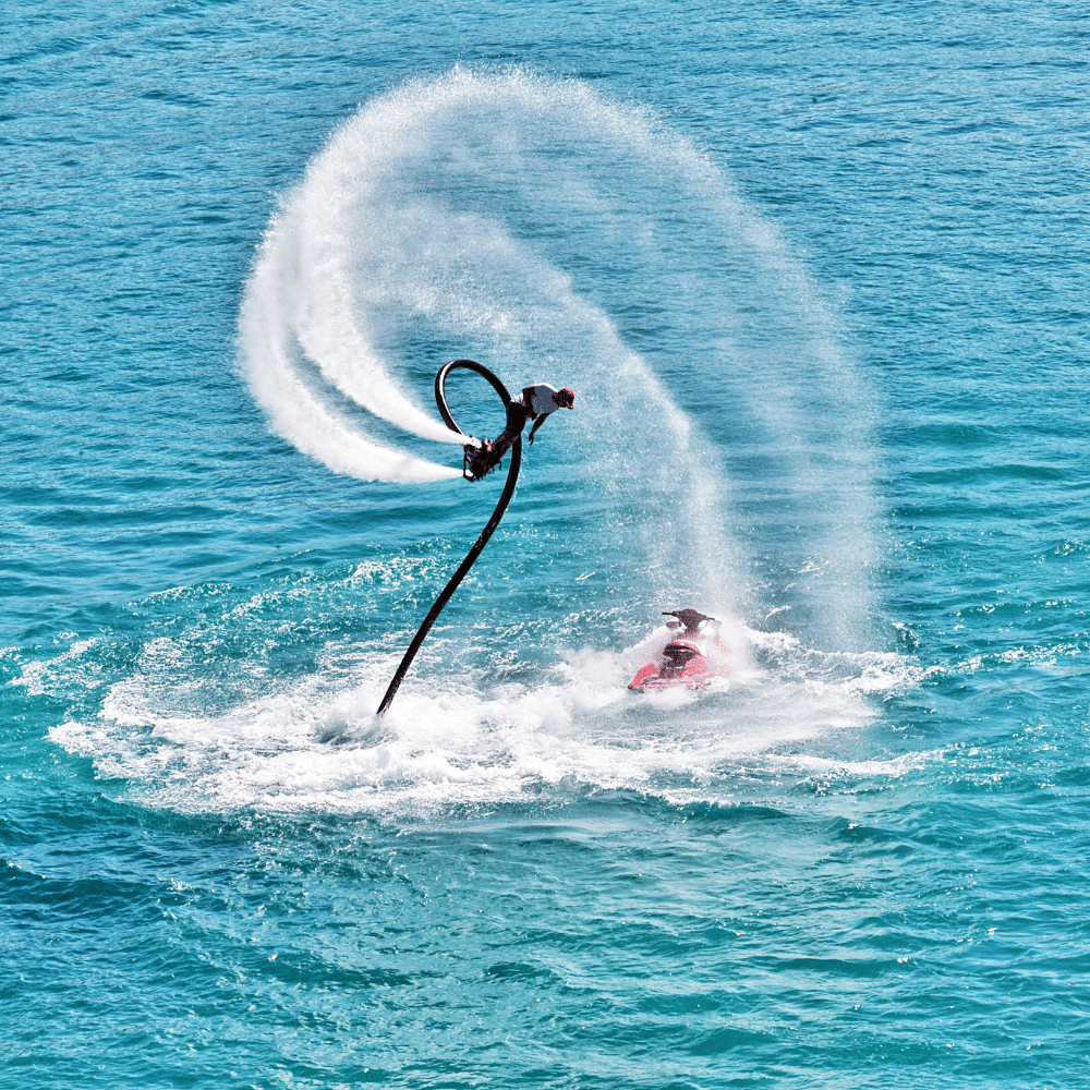 Man performing a flyboarding maneuver