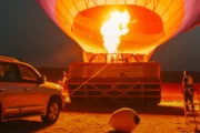 Bottom view of a colorful hot air balloon in the sky.