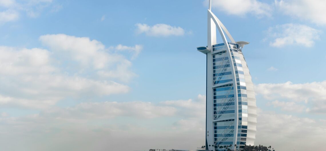 Burj Al Arab, the skyline, and the water surrounding it