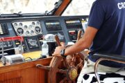 Steering controls of a traditional wooden dhow in Abu Dhabi.