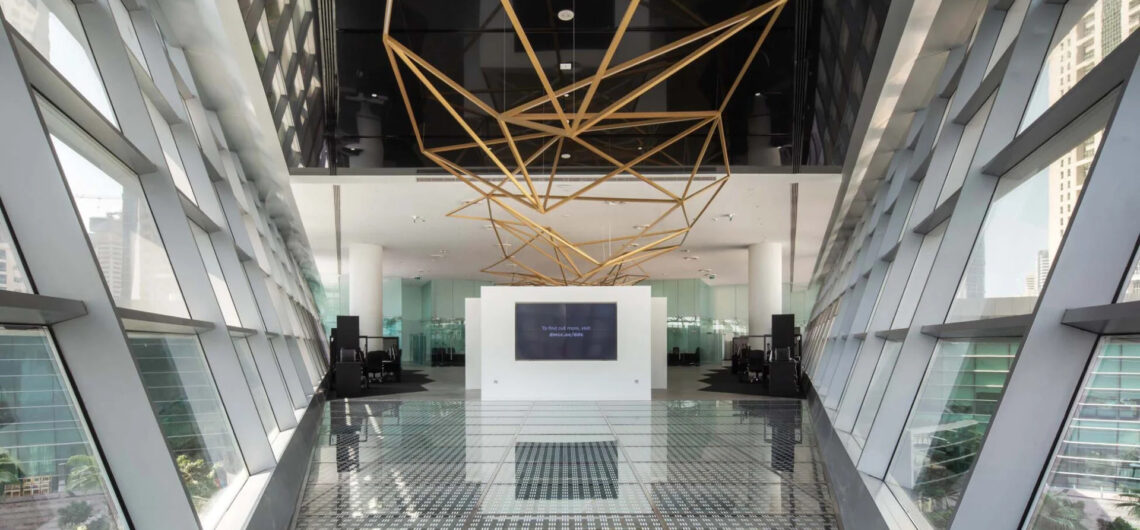 Dubai Diamond Exchange interior with geometric ceiling structure and glass walls