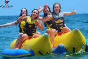 A group of friends giving thumbs up while enjoying a Banana Ride.