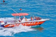 Group enjoying a thrilling speedboat ride on Adventures 3