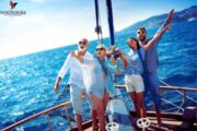 Family and friends cheering on a sailing adventure.