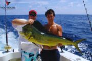 Anglers holding a large catch during a deep sea fishing trip