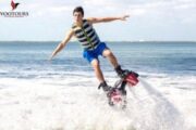 A Fly Boarder skillfully balancing in mid-air as they perform a daring jump