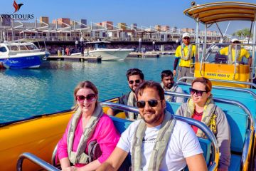 Group of tourists seated in a speedboat for an exciting island tour.