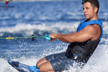 Man enjoying a thrilling Knee Boarding ride in Ras Al Khaimah.