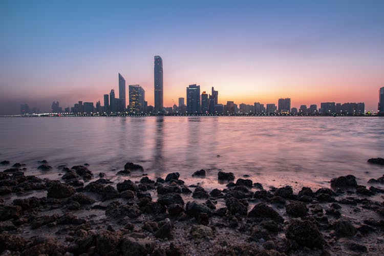 Skyscrapers in the distance and a body of water in Abu Dhabi.