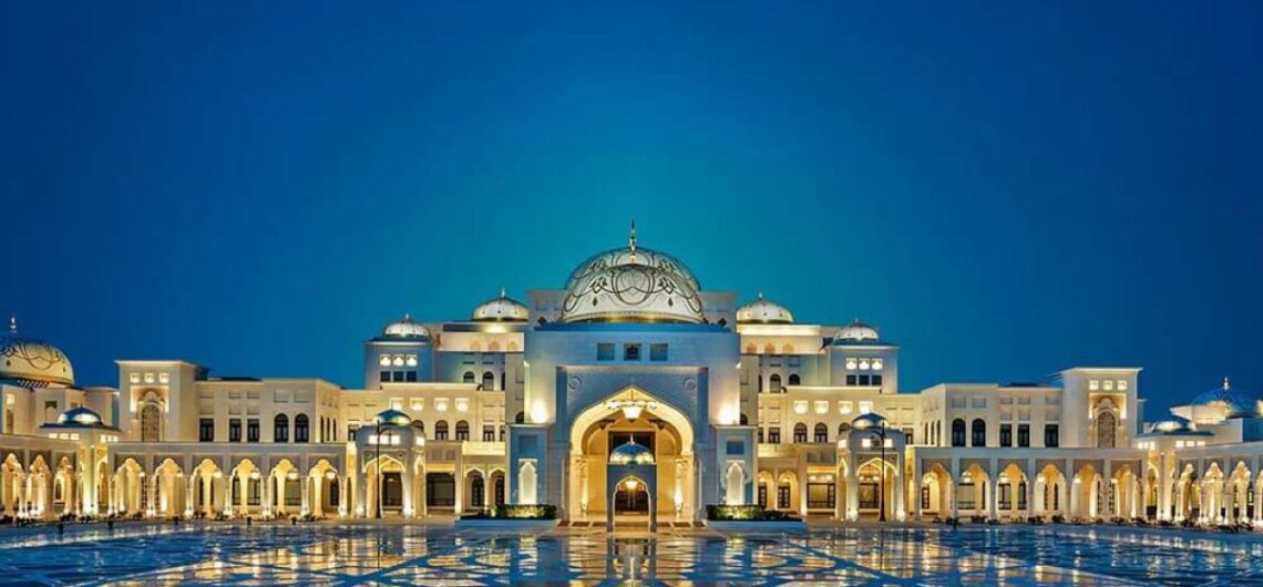 Qasr Al Watan at night with its illuminated architecture and intricate design.