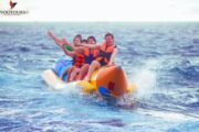 Family on a banana ride with laughter and excitement