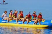 A family enjoying a relaxed Banana Safari adventure on the water in Fujairah.