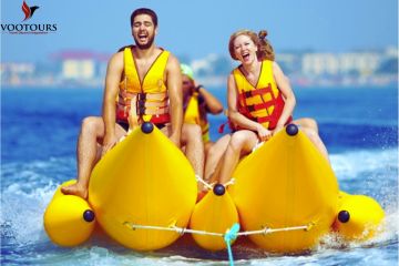 Banana Safari ride with excited participants over the sparkling waters in Fujairah.