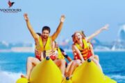 A group enjoying the thrill of a Banana Safari ride in Fujairah's calm waters