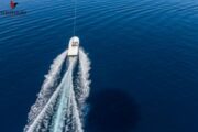 Speedboat Cutting Through Water - A speedboat creating ripples as it glides across the ocean.