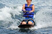 Boy enjoying kneeboarding in Fujairah