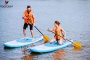 Couple Enjoying Stand Paddleboarding Adventure in Fujairah