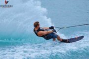 Professional water skier creating a splash in Fujairah's scenic sea