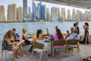 A luxury yacht sailing in Dubai Marina during a morning cruise