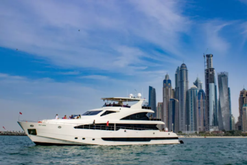 Luxury yacht cruising near Dubai skyscrapers