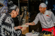 Sushi being professionally flamed by a chef onboard a yacht