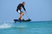 Rider Jumping with a Jet Board Over the Ocean