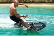 Man Riding a Jet Board on Calm Waters