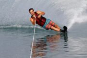 Man performing a slalom water ski maneuver in Dubai waters.