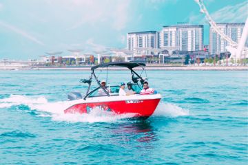 Red Speed Boat on Dubai Waters with City Skyline in Background