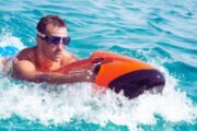 Man cruising on the water surface with a red Seabob