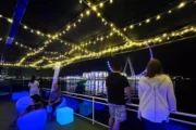 Guests enjoying Ain Dubai views from a houseboat.