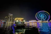 Luxury houseboat in Dubai Marina waters under the night sky