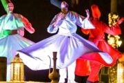 Tanoura dancers performing a mesmerizing spinning dance in colorful traditional outfits.